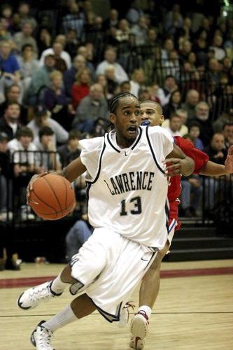 Basketball player dribbling the ball during a game.